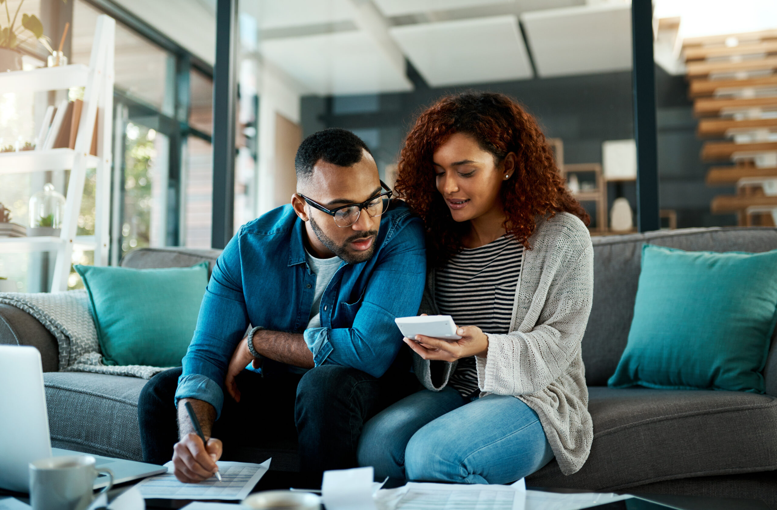 Calculator, financial checklist or couple writing with budget paperwork, notes or planning savings. Accounting, investment or people organizing bills for paying debt, finance or household expenses.